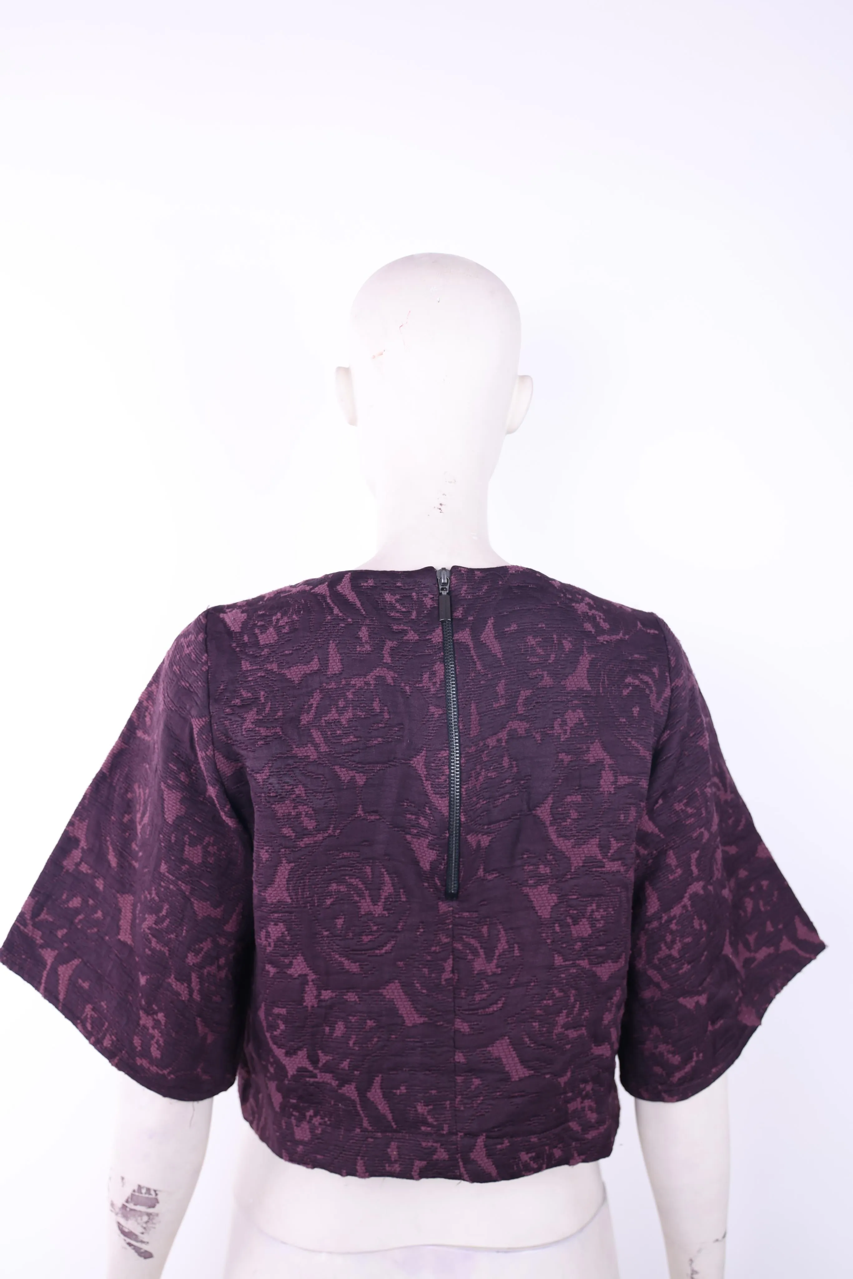 Access short purple top with ruffled mid length sleeves