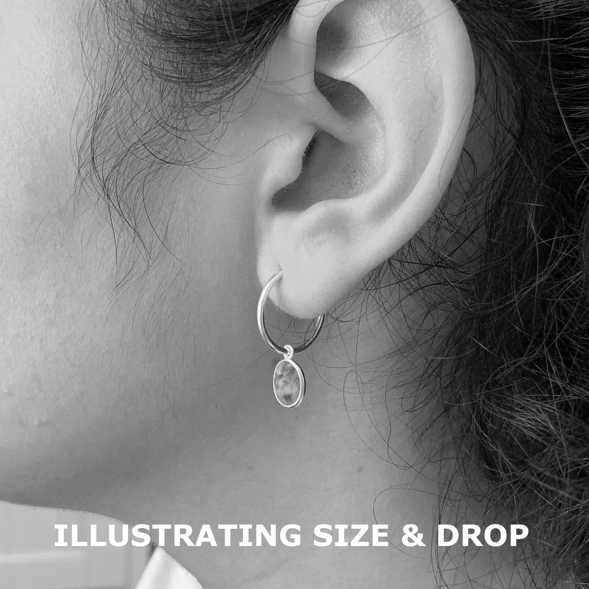 Gemstone earrings with amethyst (purple) oval crystal drops on gold small hoops